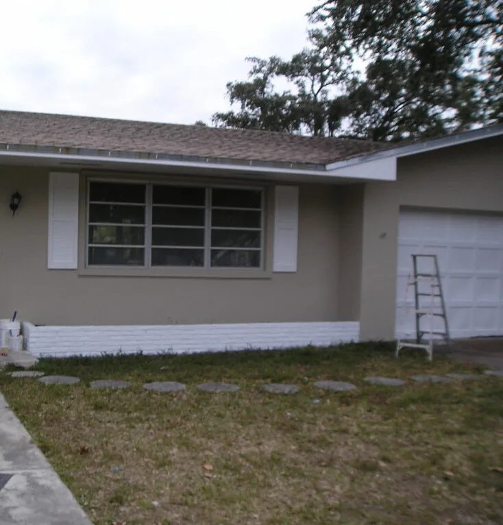 Single-family home exterior repaint in progress